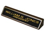 28BW - 2" x 8" Black Brass Nameplate on Wood 